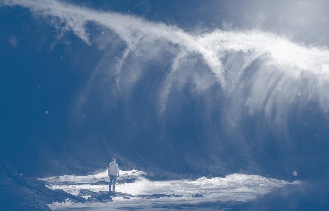 Man in front of a tsunami